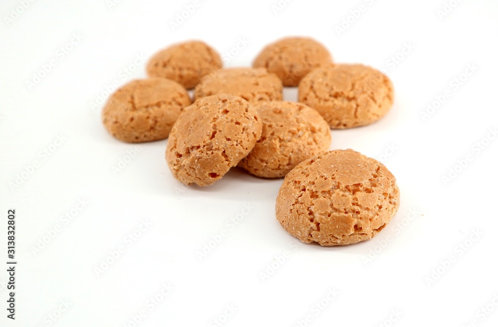 Amaretti, almond based traditional italian biscuits, on white background Amaretti, almond based traditional italian biscuits, on white background
