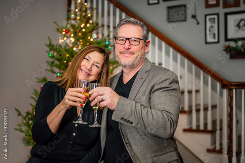 Canvas Print happy middle age couple celebrating wedding anniversary