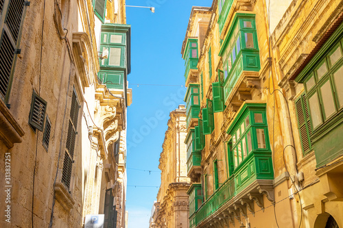 Maltese streets and colorful wooden balconies in Valletta  Malta