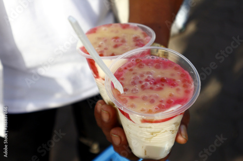 Cups of strawberry and milk flavored Taho with Sago photo