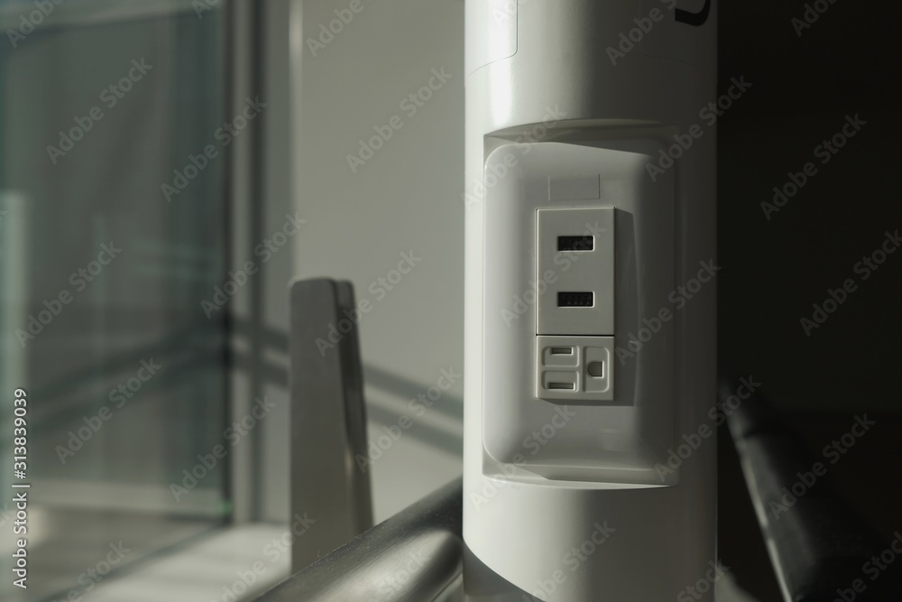 power plug on the white pole in dark tone power plug on the white pole in dark tone
