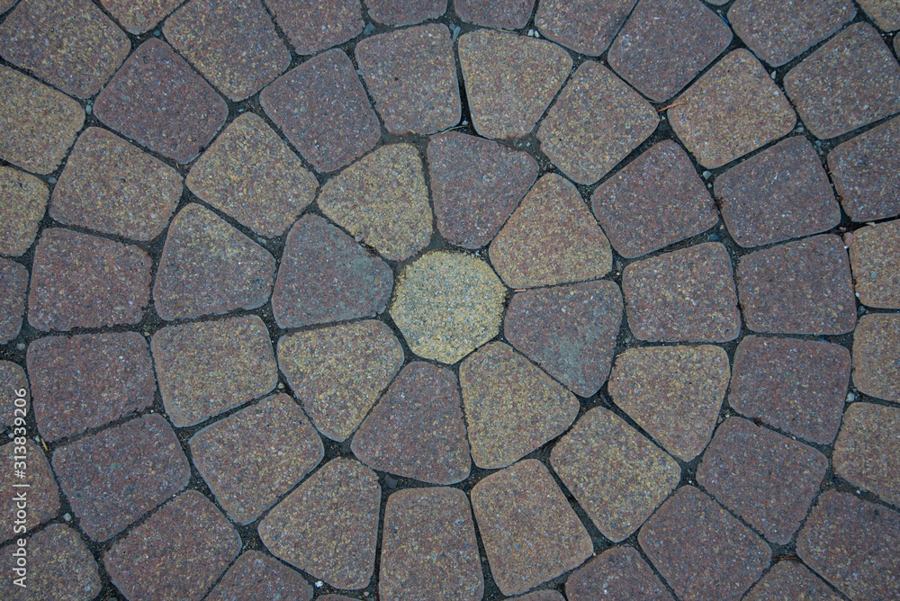Sidewalk tiles laid out from the center. The circular walls. Stock