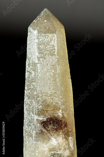 Macro mineral stone Prase with amethyst phantom on a gray background