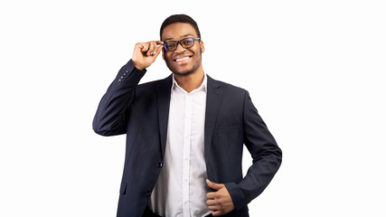 Smiling handsome businessman isolated over white background