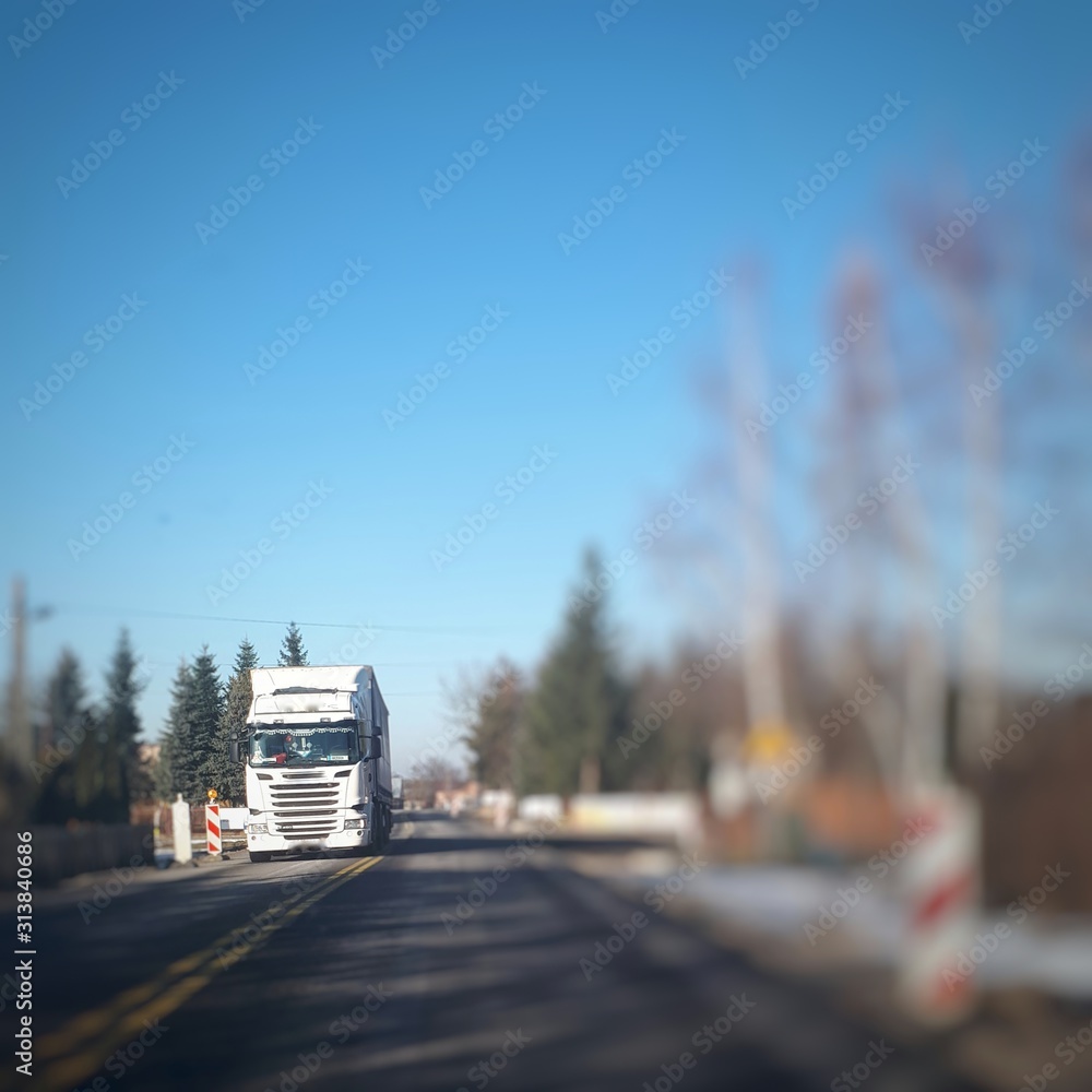 Abstract blurred background with asphalt road in Poland. Transportation bokeh concept background. Abstract blurred background with asphalt road in Poland. Transportation bokeh concept background.