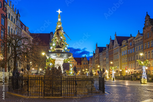 Beautiful architecture of the Long Lane in Gdansk with Christmas ligths at dawn, Poland.