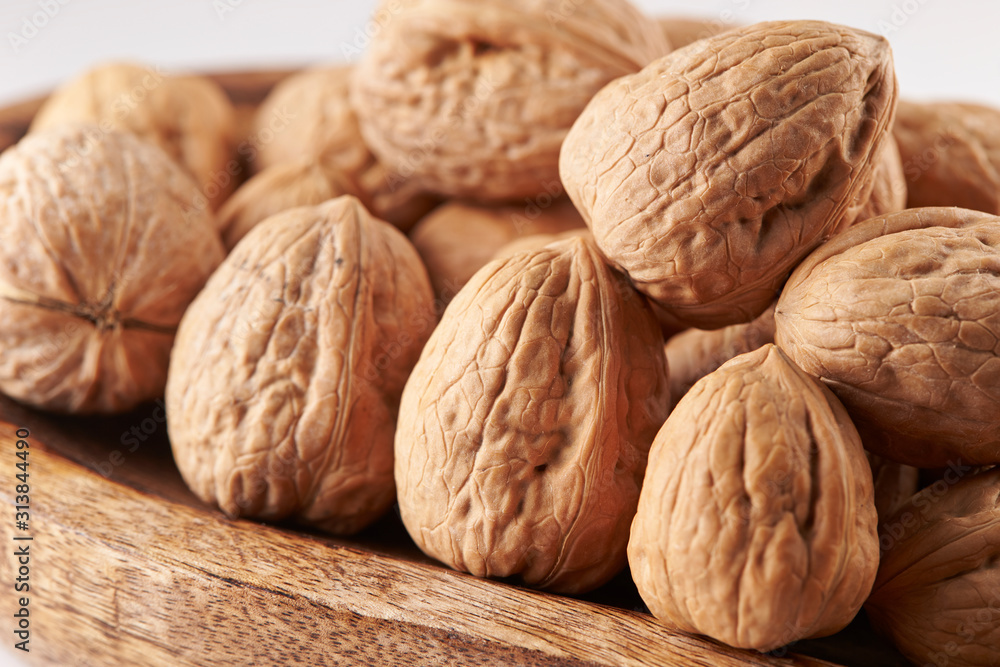 Heap of walnuts on white background Heap of walnuts on white background