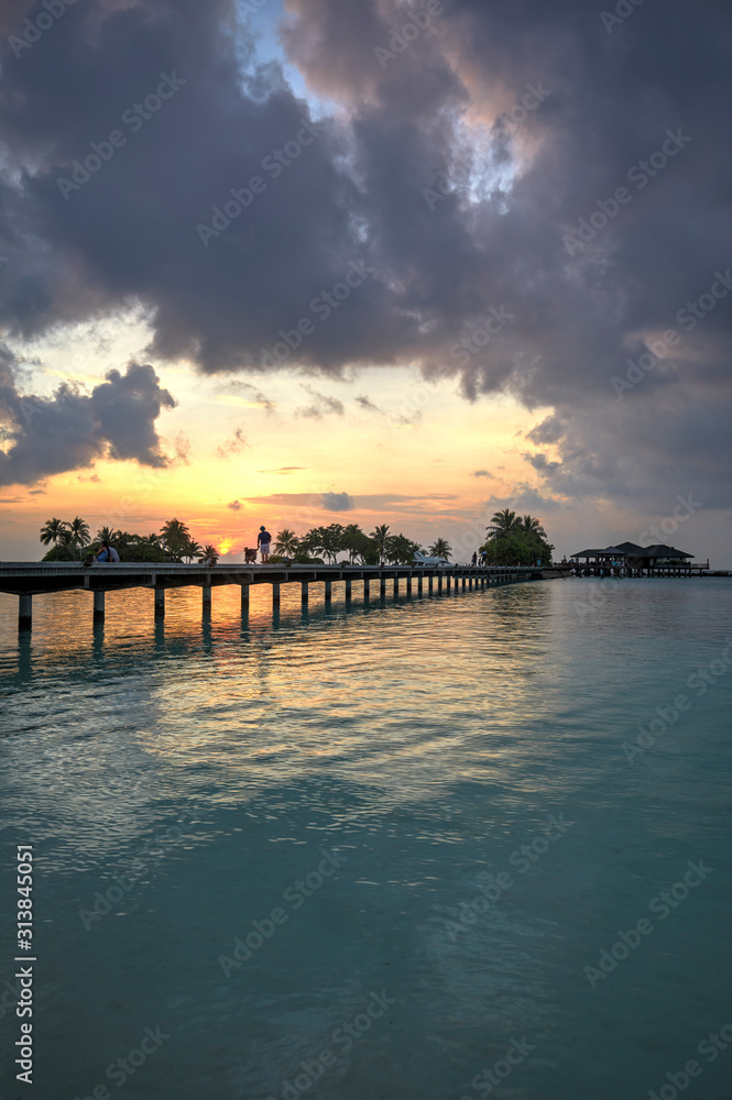 Footbridge of Paradise Island (Lankanfinolhu) at sunset, Maldives