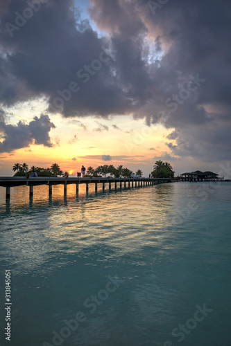 Footbridge of Paradise Island  Lankanfinolhu  at sunset  Maldives