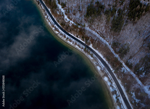 Aerial view of a winter road near a Lake in austria