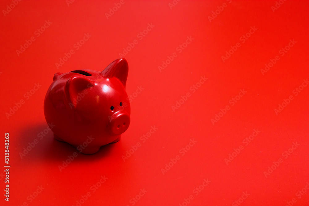 Red piggy Bank on a red background