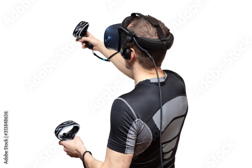A man in the virtual reality touches an invisible object isolated on white © Sonate