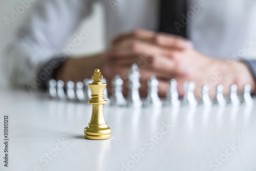 Wallpaper Mural Gold and silver chess with player, Hands of businessman moving chess figure in competition to planning strategy to success play for win Torontodigital.ca
