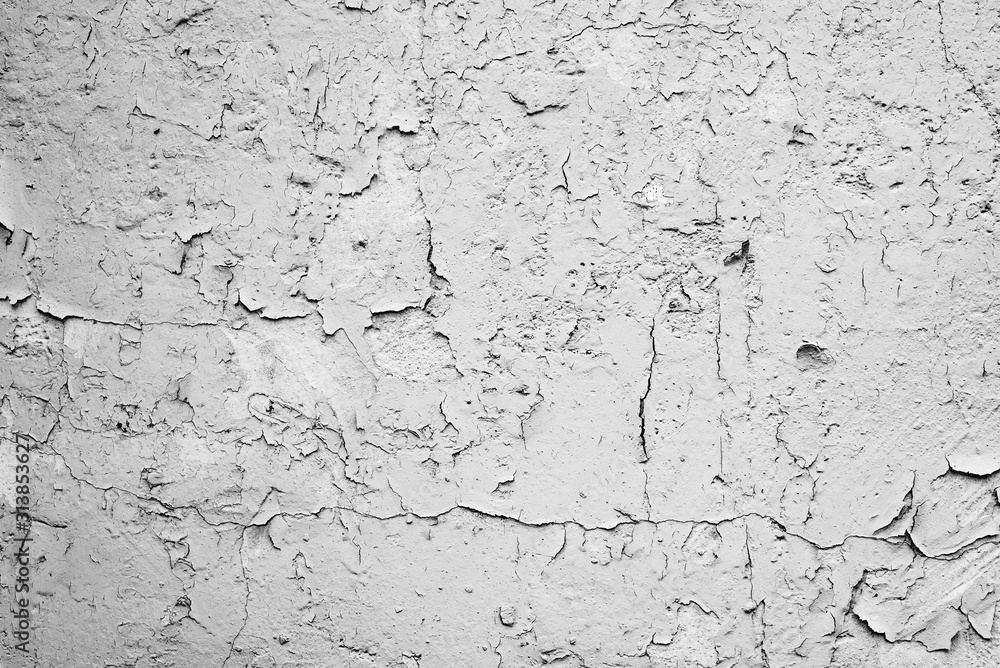 Fototapeta premium Texture of a concrete wall with cracks and scratches which can be used as a background