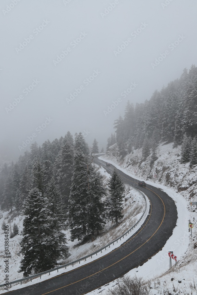 Winter road in the forest. Aerial view the a winding mountain road at .turkey