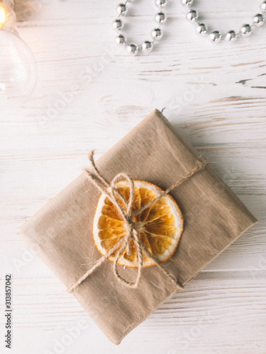 Christmas gifts on a white wooden background.