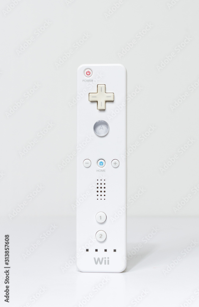 Foto Stock london, england 05/052019 Nintendo wii Controller on a white  isolated background. iconic retro vintage video gaming controller machine.  Japanese technology family gaming fun. | Adobe Stock
