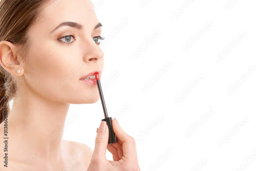 Woman applying lipstick