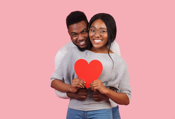Adorable african man and woman celebrating St Valentine's Day