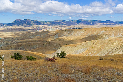 Clay ravines with traces of soil erosion and weathering. photo