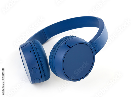 Blue wireless headphones isolated on white photo