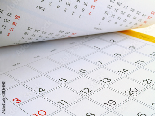 Photography desk calendar with days and dates in July 2016, flip over the calendar page clos
