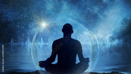 Fotografie, Obraz Yoga cosmic space meditation illustration, silhouette of man practicing outdoors