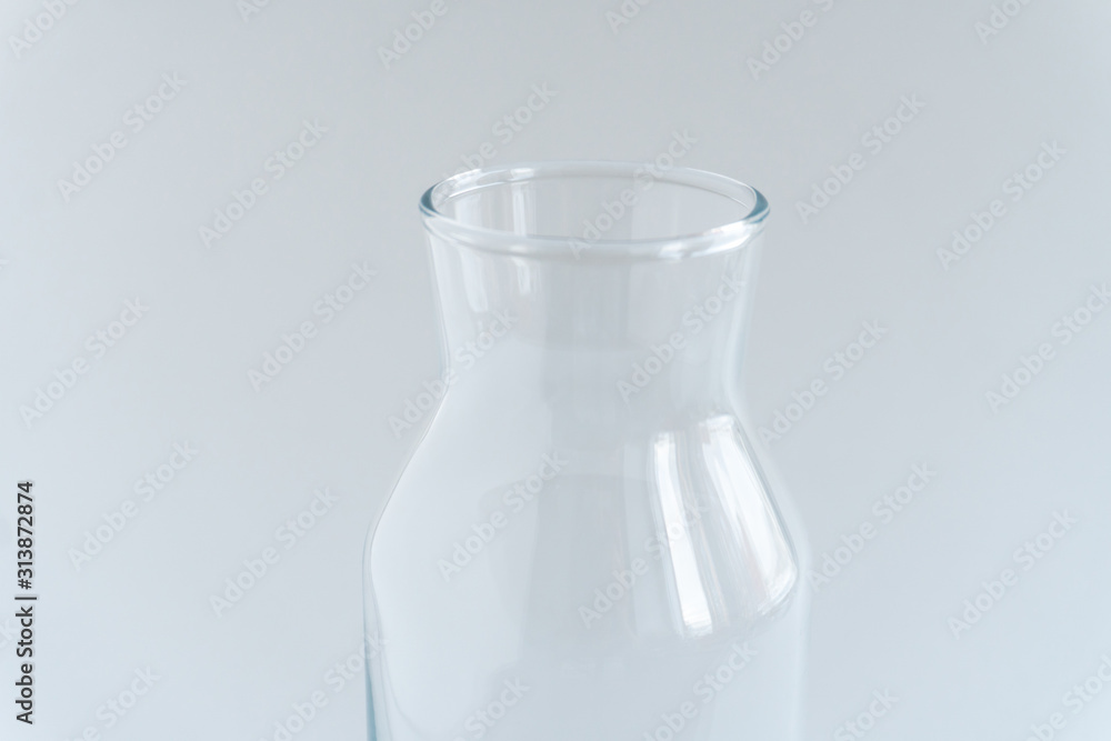 Glass bottle at gray backround. Zero waste concept. Glass bottle at gray backround. Zero waste concept.
