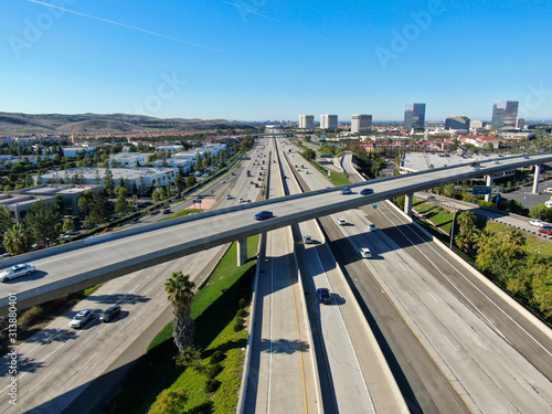 Fototapeta Aerial view of highway transportation with small traffic, highway interchange and junction, San Diego Freeway and Santa Ana Freeway