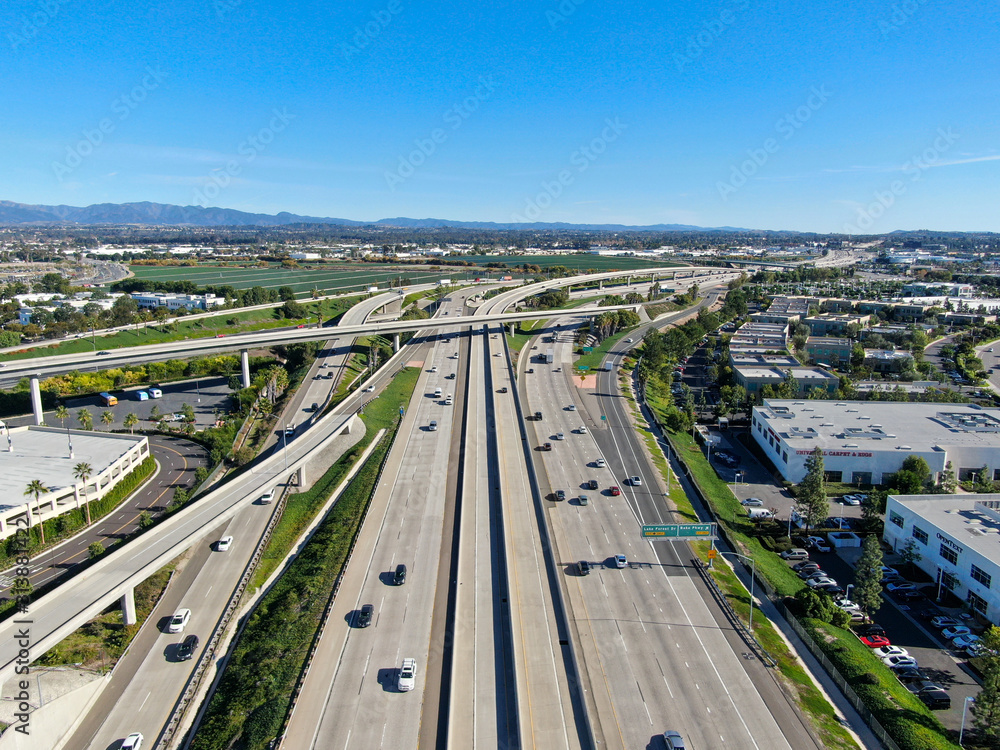 Fototapeta Aerial view of highway transportation with small traffic, highway interchange and junction, San Diego Freeway and Santa Ana Freeway. USU California