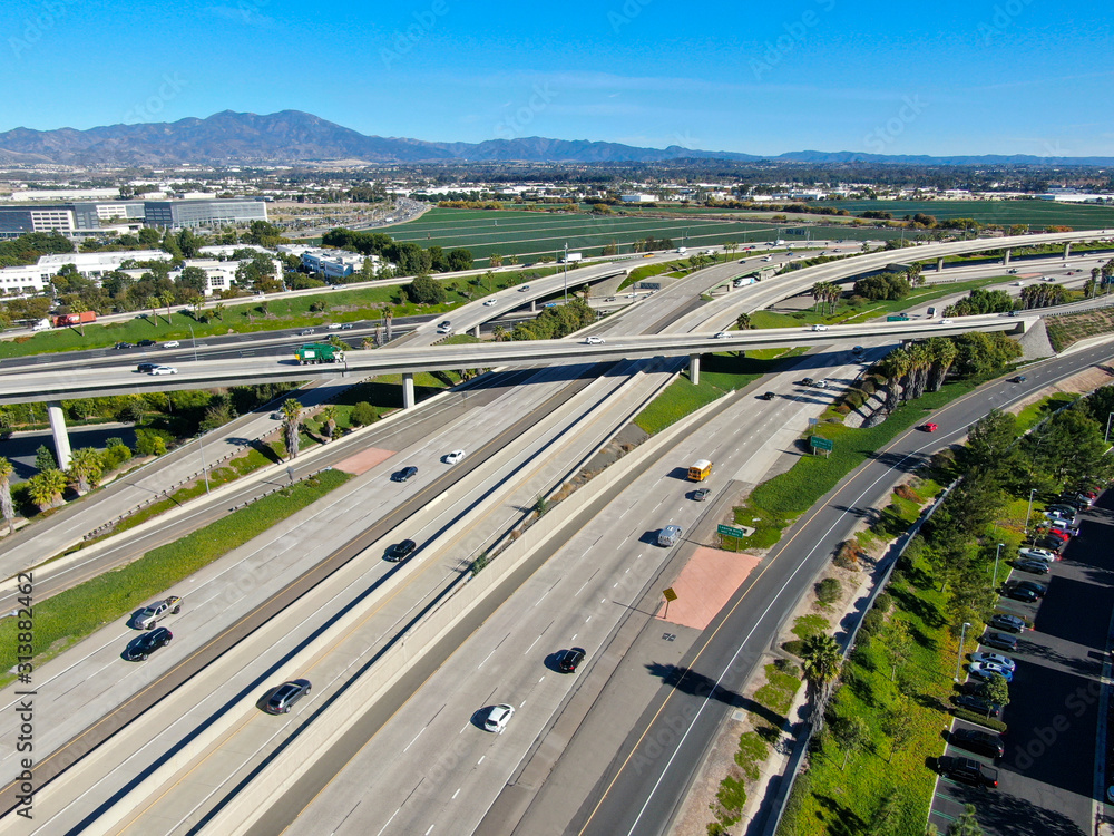 Fototapeta Aerial view of highway transportation with small traffic, highway interchange and junction, San Diego Freeway and Santa Ana Freeway. USU California