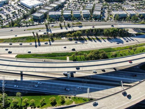 Aerial view of highway transportation with small traffic, highway interchange and junction, San Diego Freeway and Santa Ana Freeway. USU California
