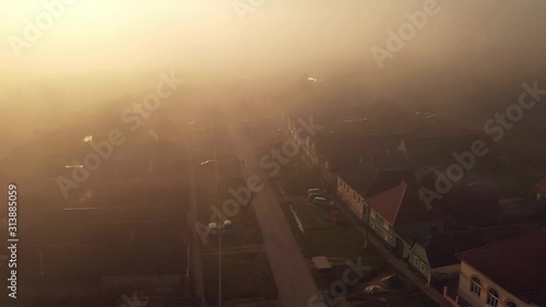 4k drone footage captured during magic golden hour light, showing street life on a beautiful morning in Crit village, Transylvania photo