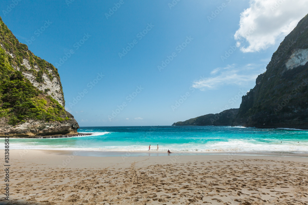 BALI, INDONESIA - MAY 12, 2018: Remote beach in the blue lagoon. BALI, INDONESIA - MAY 12, 2018: Remote beach in the blue lagoon.