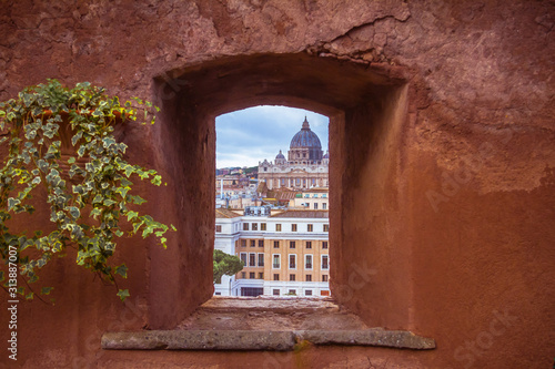 Photography View of Saint Peter's Cathedral through a stone window of Castel Sant'Angelo