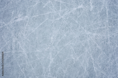 Canvas Print Ice background with marks from skating and hockey, blue texture of rink surface