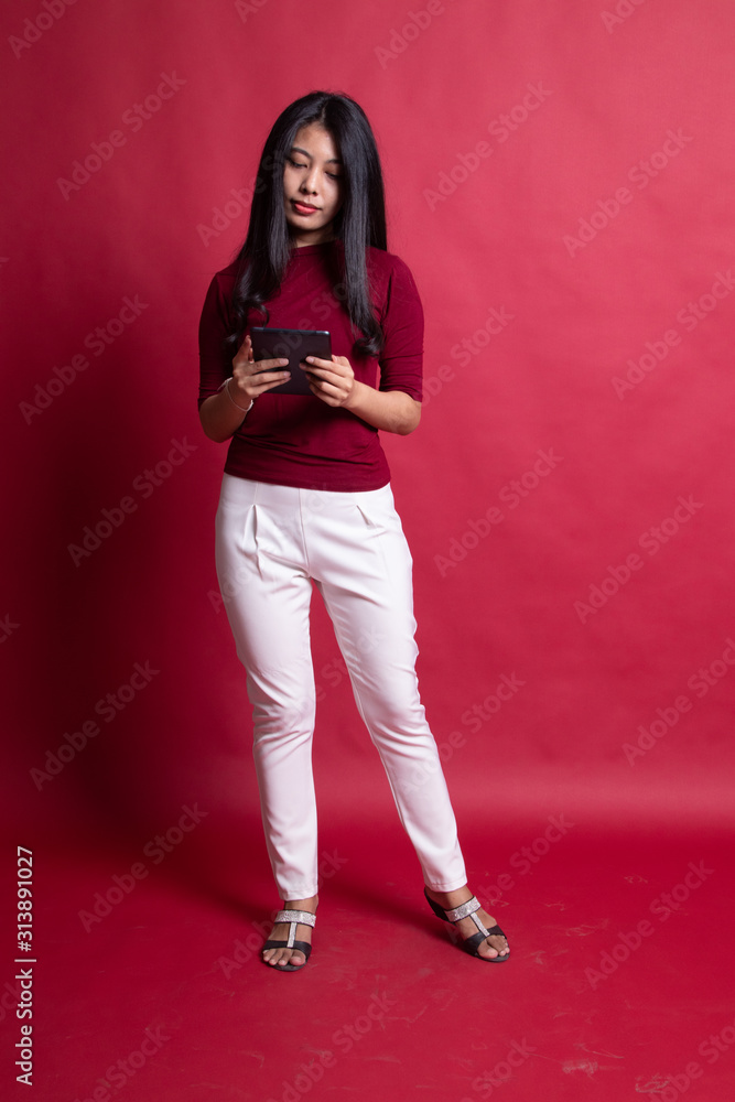 Young Asian woman with a computer tablet. Young Asian woman with a computer tablet.