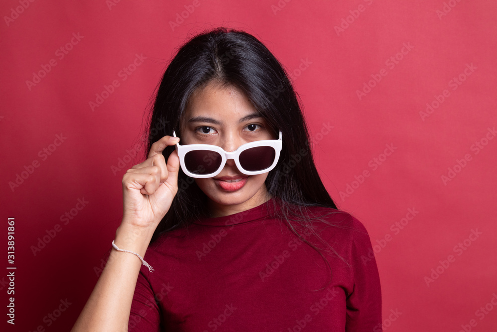 Portrait of a beautiful young asian girl in sunglasses. Portrait of a beautiful young asian girl in sunglasses.