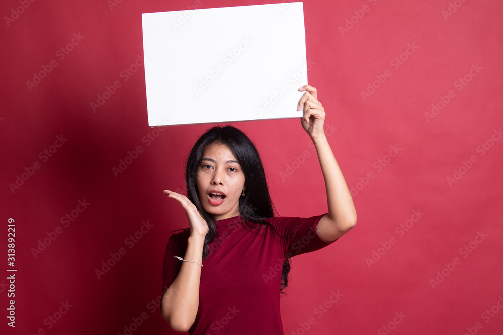 Young Asian woman surprise with white blank sign. Young Asian woman surprise with white blank sign.
