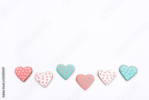 Gingerbread cookies with frosting in the shape of a heart. Valentines day concept. Flat lay, top view, copy space for text.
