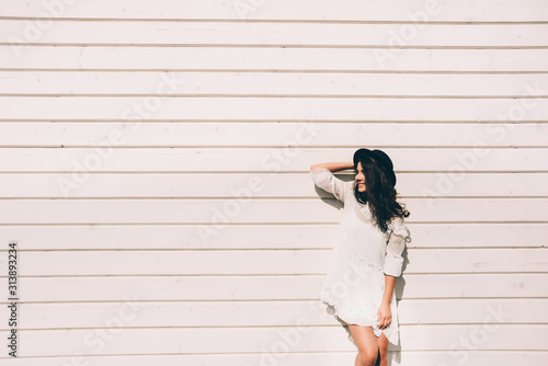 portrait of young stylish hipster woman , wearing trendy white dress