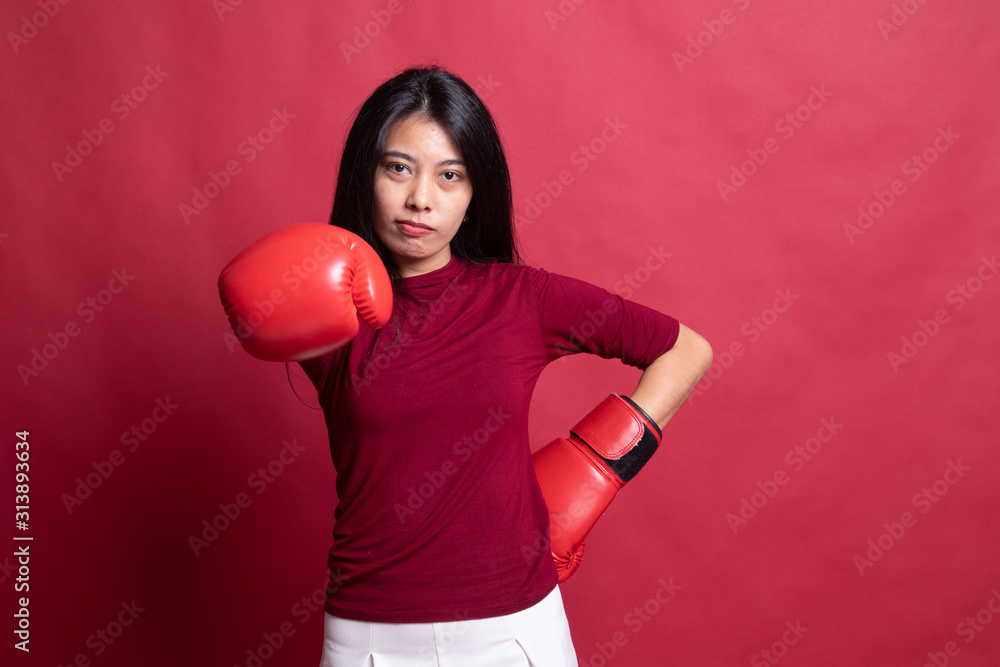 Young Asian woman with red boxing gloves. Young Asian woman with red boxing gloves.