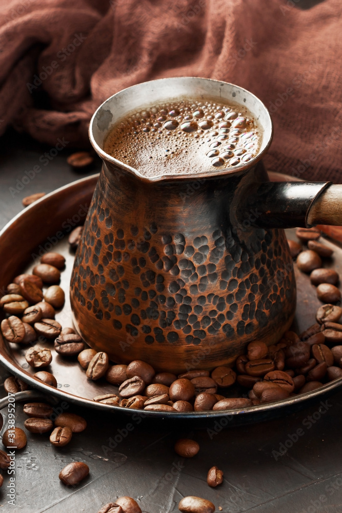 Traditional Turkish coffee in traditional copper  coffee pot
