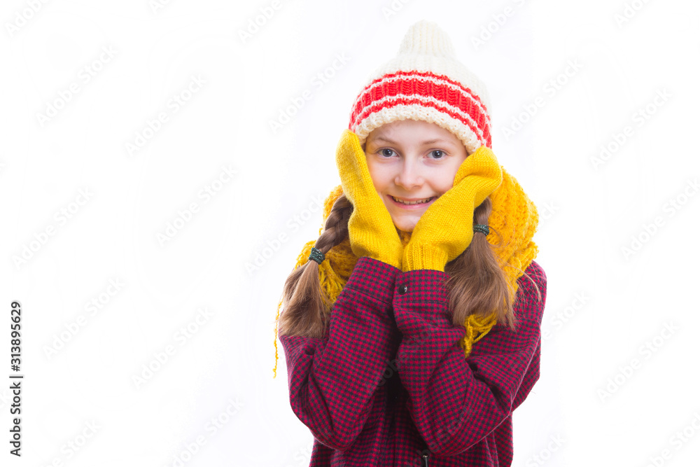 Winter Kids Concepts. Portrait of Surprised Caucasian Girl Posing in Winter Outfit Against White in Studio.