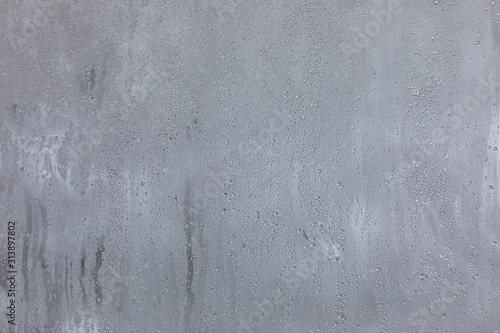 The texture of fogged glass in a warm room