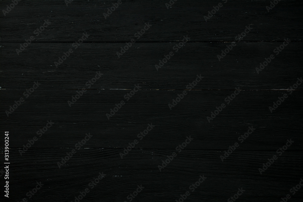 Naklejka premium The structure of old, shabby black boards arranged horizontally.