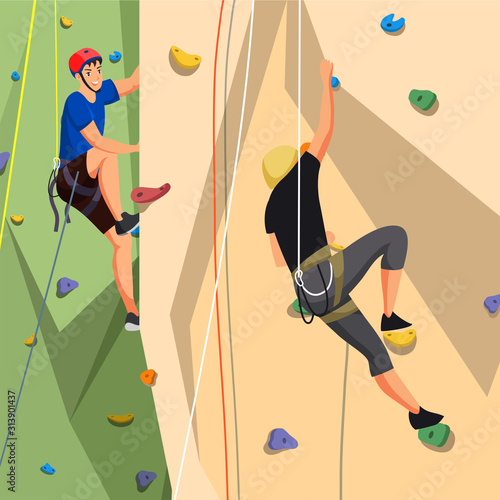 People in sportswear training on climbing wall