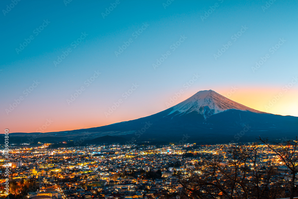 The twilight of the city below Mount Fuji, sunset.