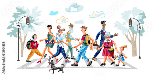 Urban residents cross road at crosswalk on green