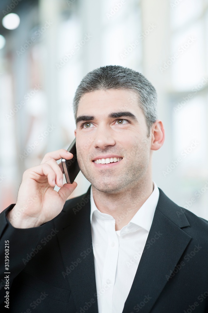 Close-up of businessman on mobile phone Close-up of businessman on mobile phone